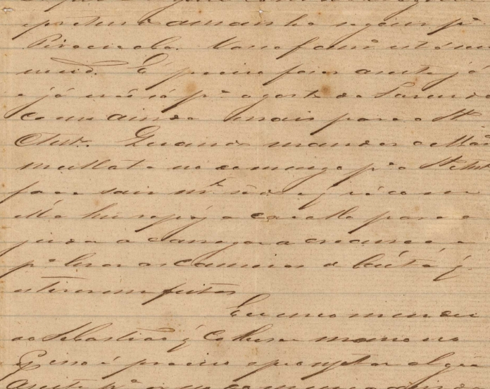 Recorte de um manuscrito antigo, em letra cursiva. A página tem coloração amarelada e a escrita em tom escuro. Sabemos que se trata da carta de Antonio Carlos de Arruda Botelho à sua esposa Anna Carolina de Oliveira, de 1867.